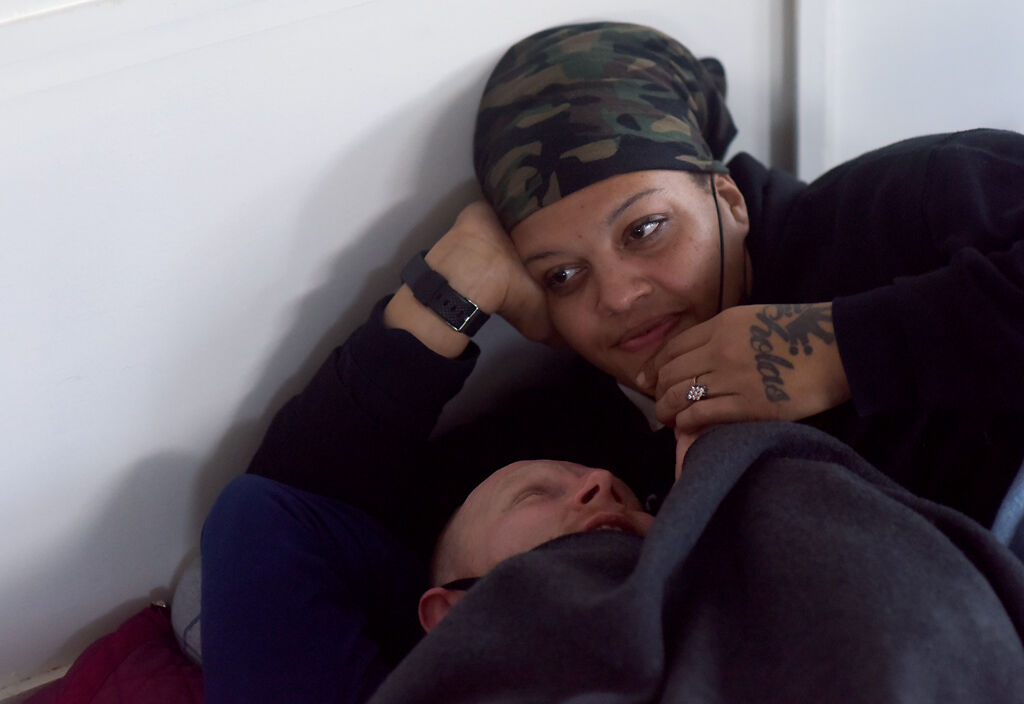 Kara Williams, right, lies with her significant other